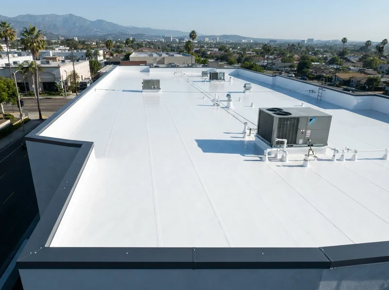White TPO flat roof with charcoal flashing White TPO flat roof with charcoal flashing
