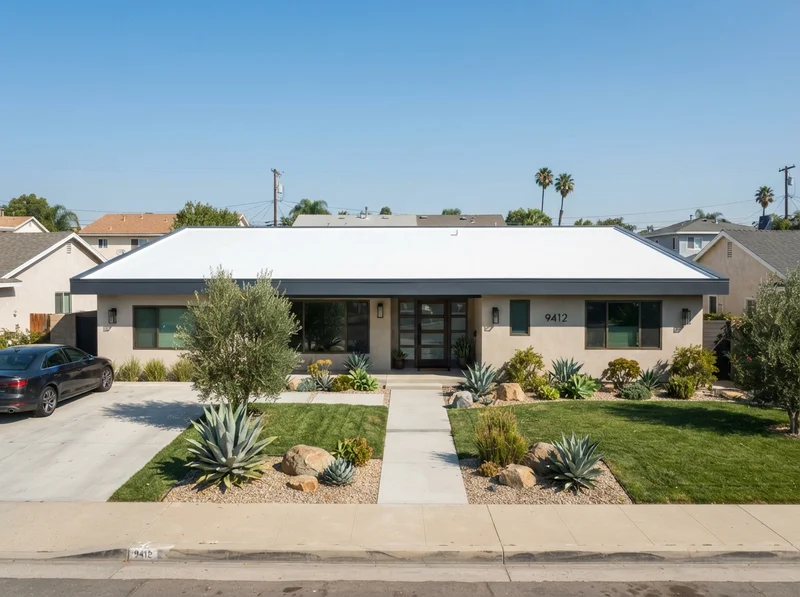 Modern home with white TPO roof Modern home with white TPO roof